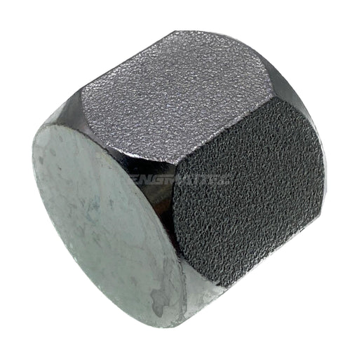 Close-up of a hexagonal steel nut with textured surface, used in industrial applications.